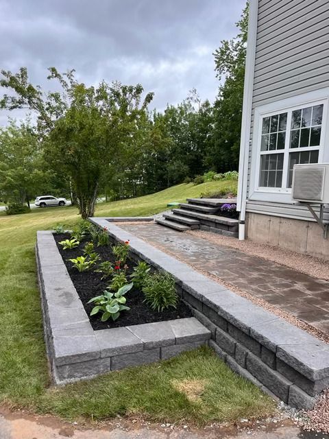 Custom paver patio with retaining walls and landscape steps installed in Halifax NS by Move Mountains Landscaping Inc.