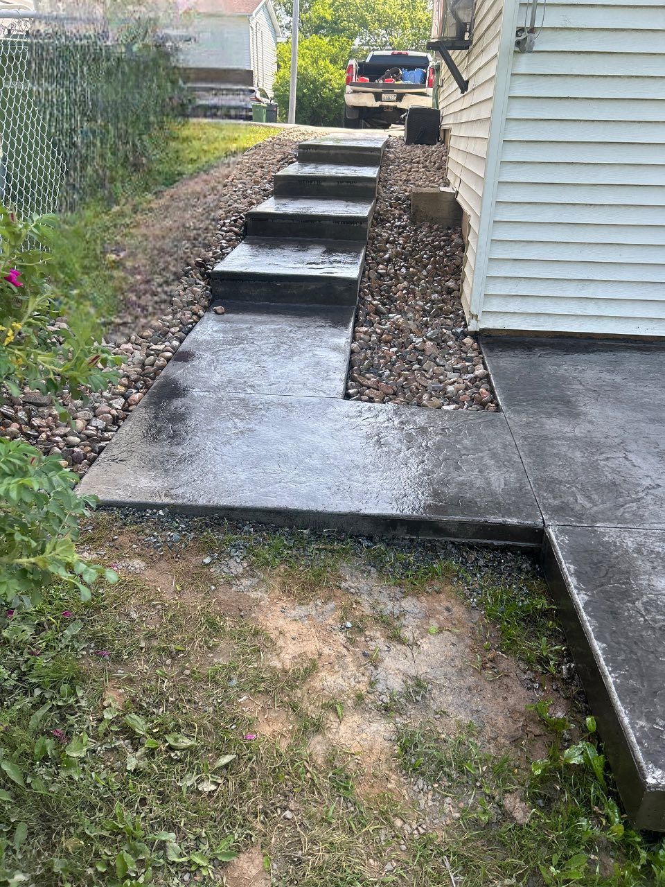 walkway and a staircase beside a house