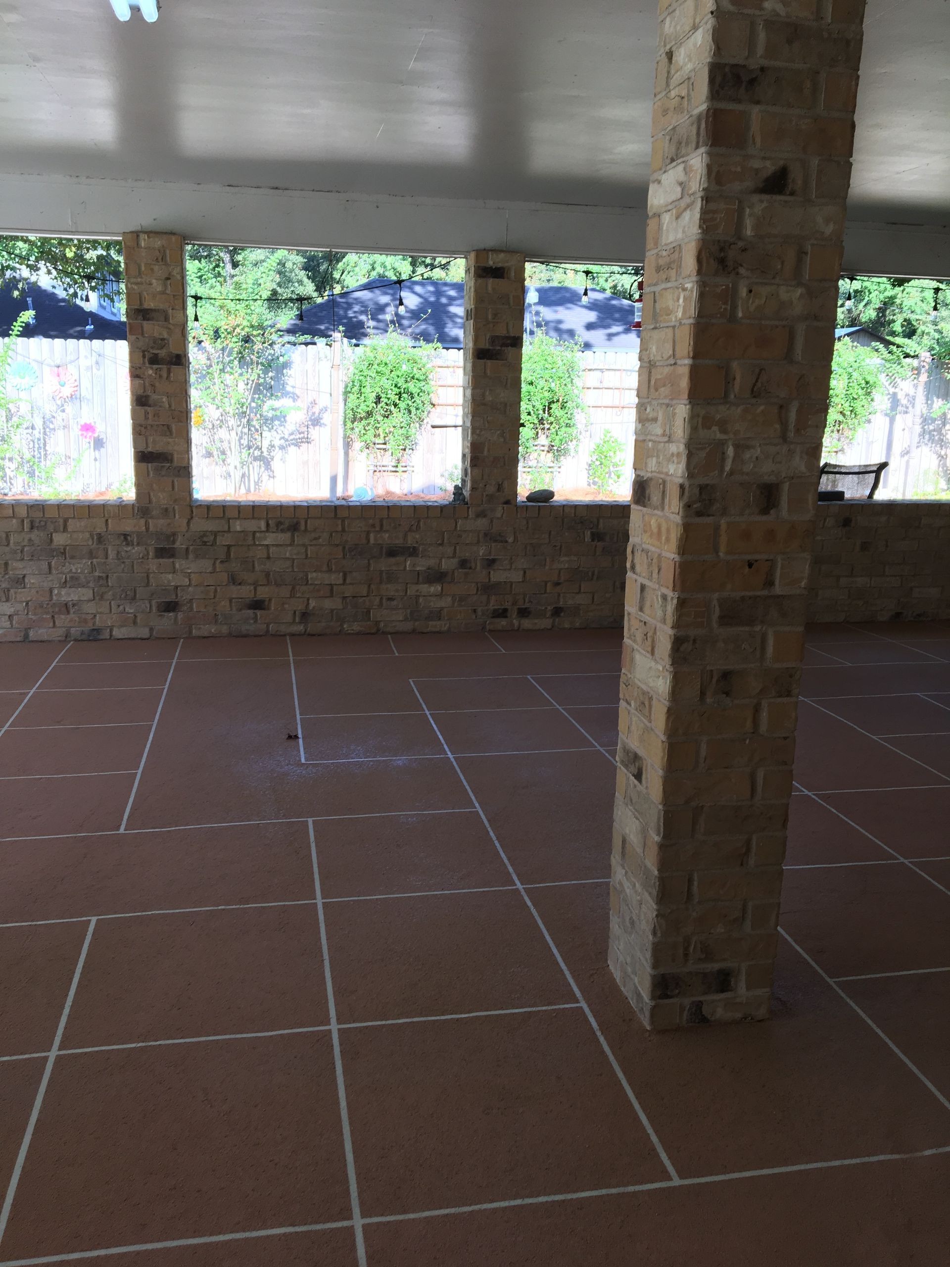 Decorative concrete overlay on covered brick patio, Montgomery TX