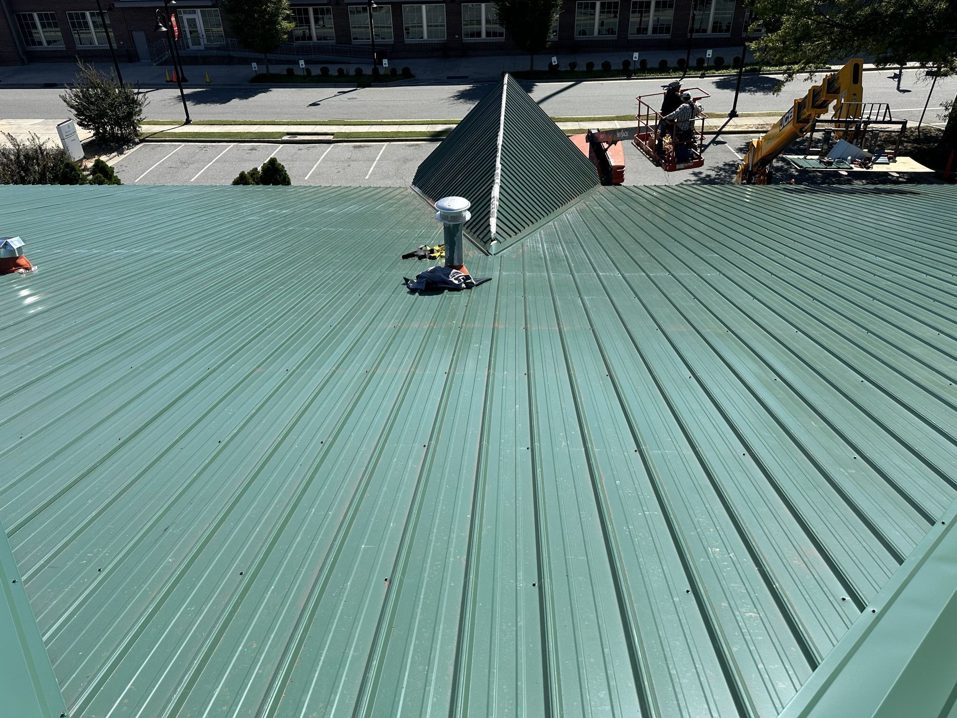 New green metal roof panels installed at Peters Development medical office building in High Point, NC.