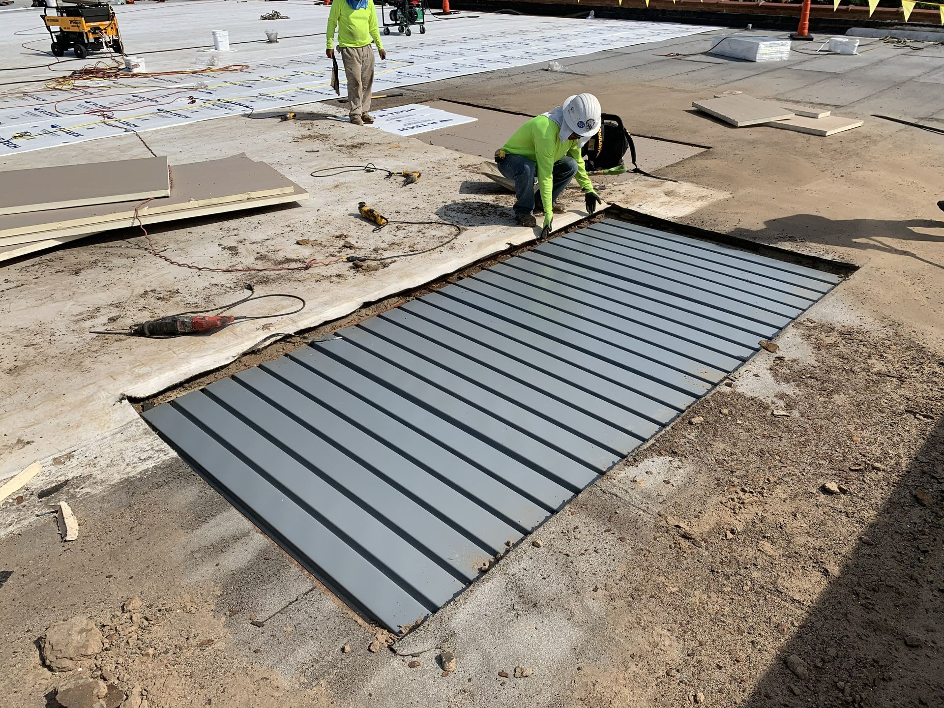 Replacement of deteriorated metal roof decking during the Franklin Properties commercial TPO roof recover in Greensboro, NC, by B&D Roofing Solutions.