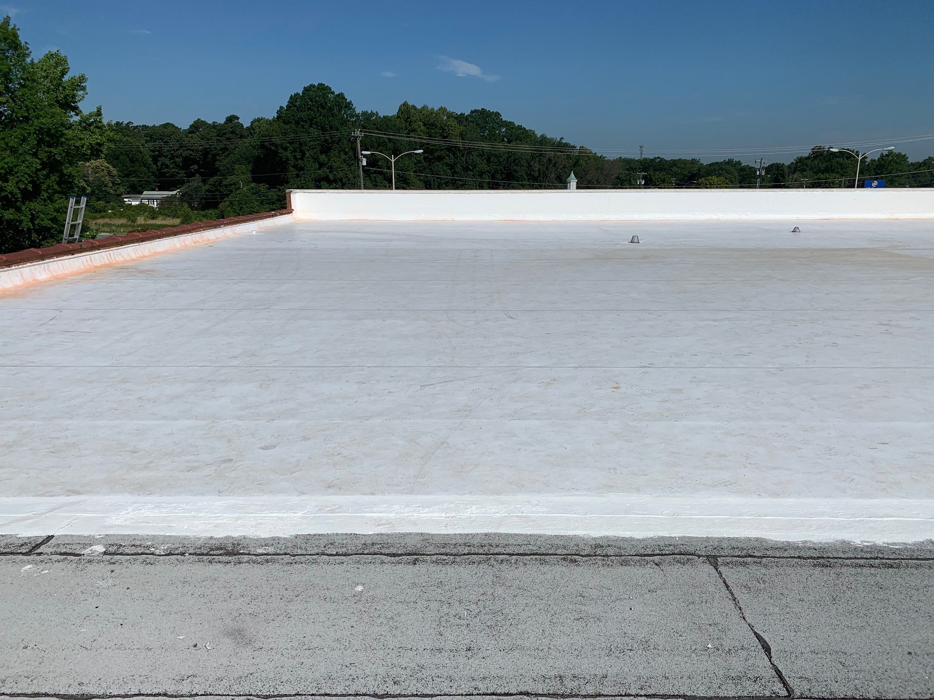 Completed 10,000 SF Carlisle TPO commercial roof recover installed by B&D Roofing Solutions for Franklin Properties in Greensboro, NC.