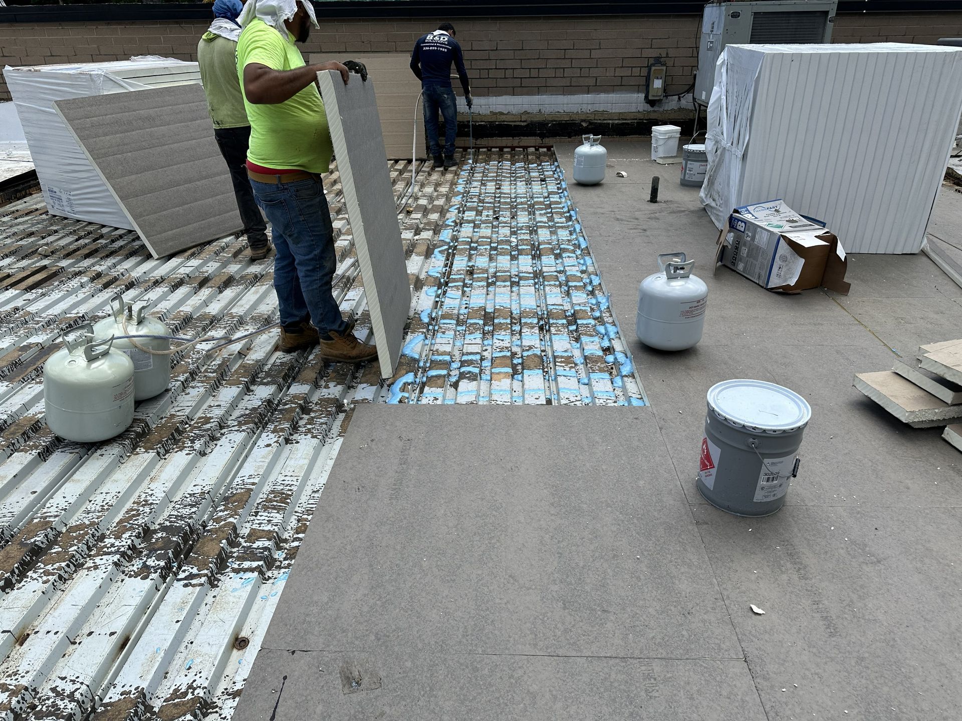 Installation of new polyiso roof insulation during the Boss Design commercial roof replacement in High Point, NC, by B&D Roofing Solutions.