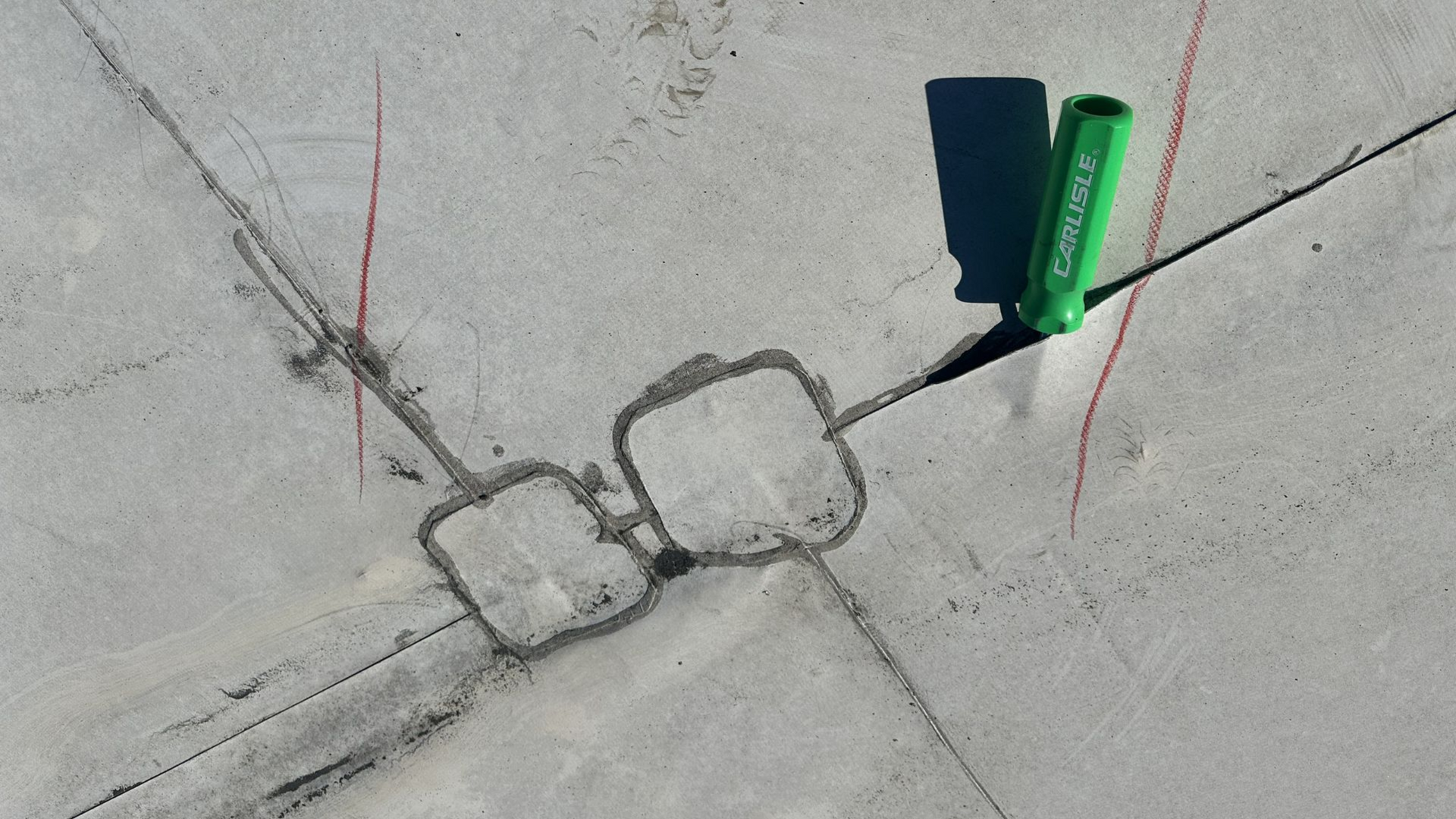 B&D Roofing Solutions inspecting an open seam during a commercial roof moisture survey.