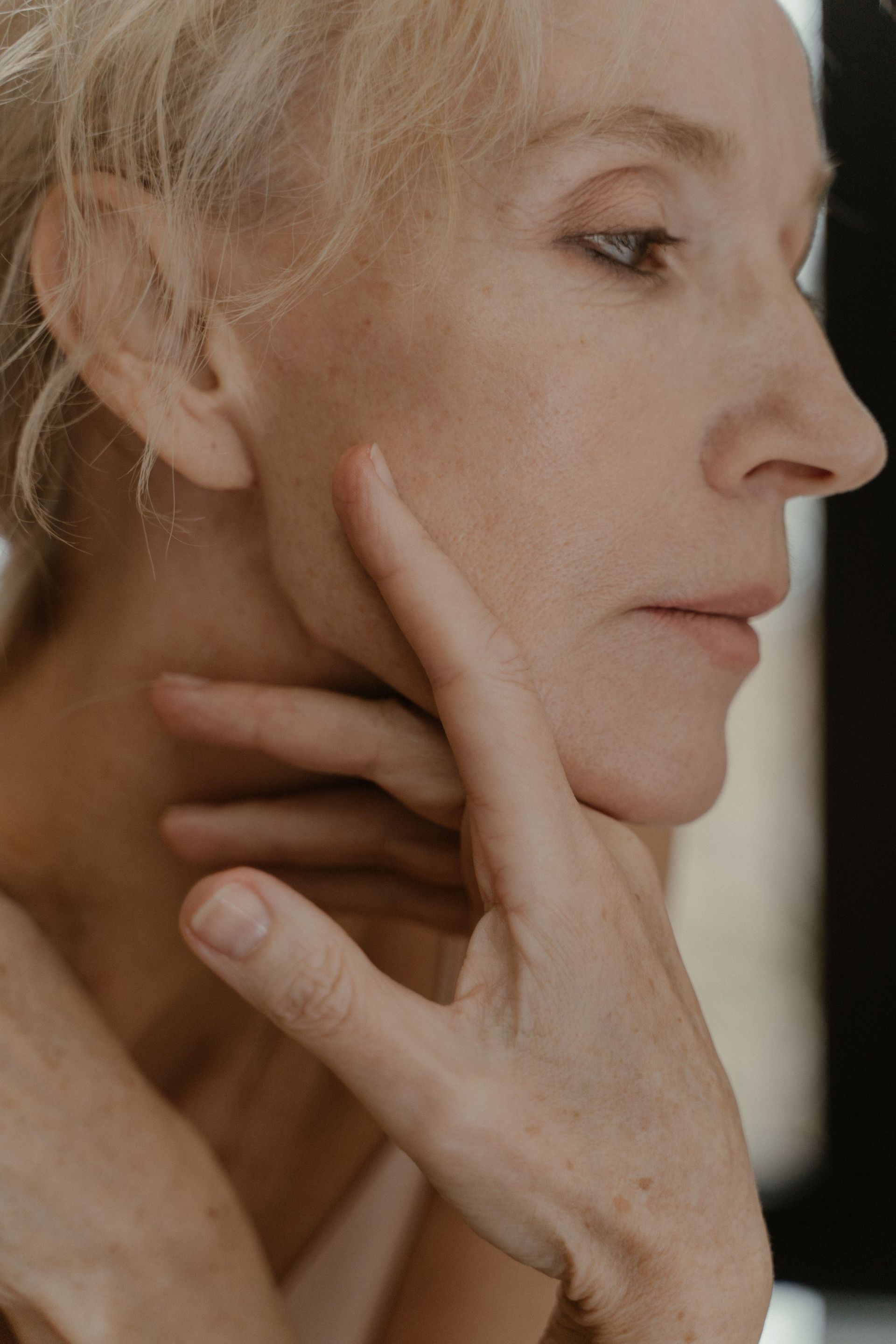 Middle aged woman, side profile view.

