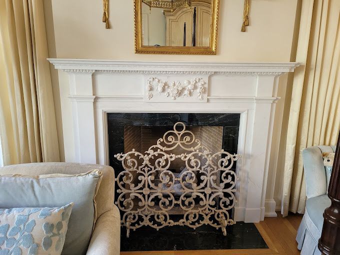 A living room with a fireplace and a couch.