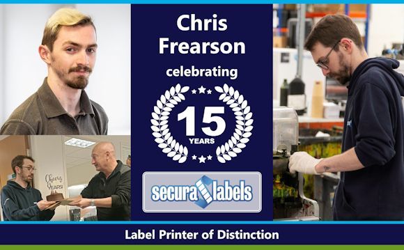 Collage celebrating Chris Frearson’s 15 years’ service at Secura Labels. The centre panel features text: 'Chris Frearson celebrating 15 years' with a laurel wreath design in white and the Secura Labels logo below that. The top left image is a professional portrait of Chris wearing a grey polo shirt, whilst the bottom left image shows Chris being presented with a cake (with a topper saying ‘Cheers to 15 Years’) and an envelope by the Managing Director, whilst the right hand image shows Chris hard at work, adjusting something on the press. The banner at the bottom reads: 'Label Printer of Distinction'.