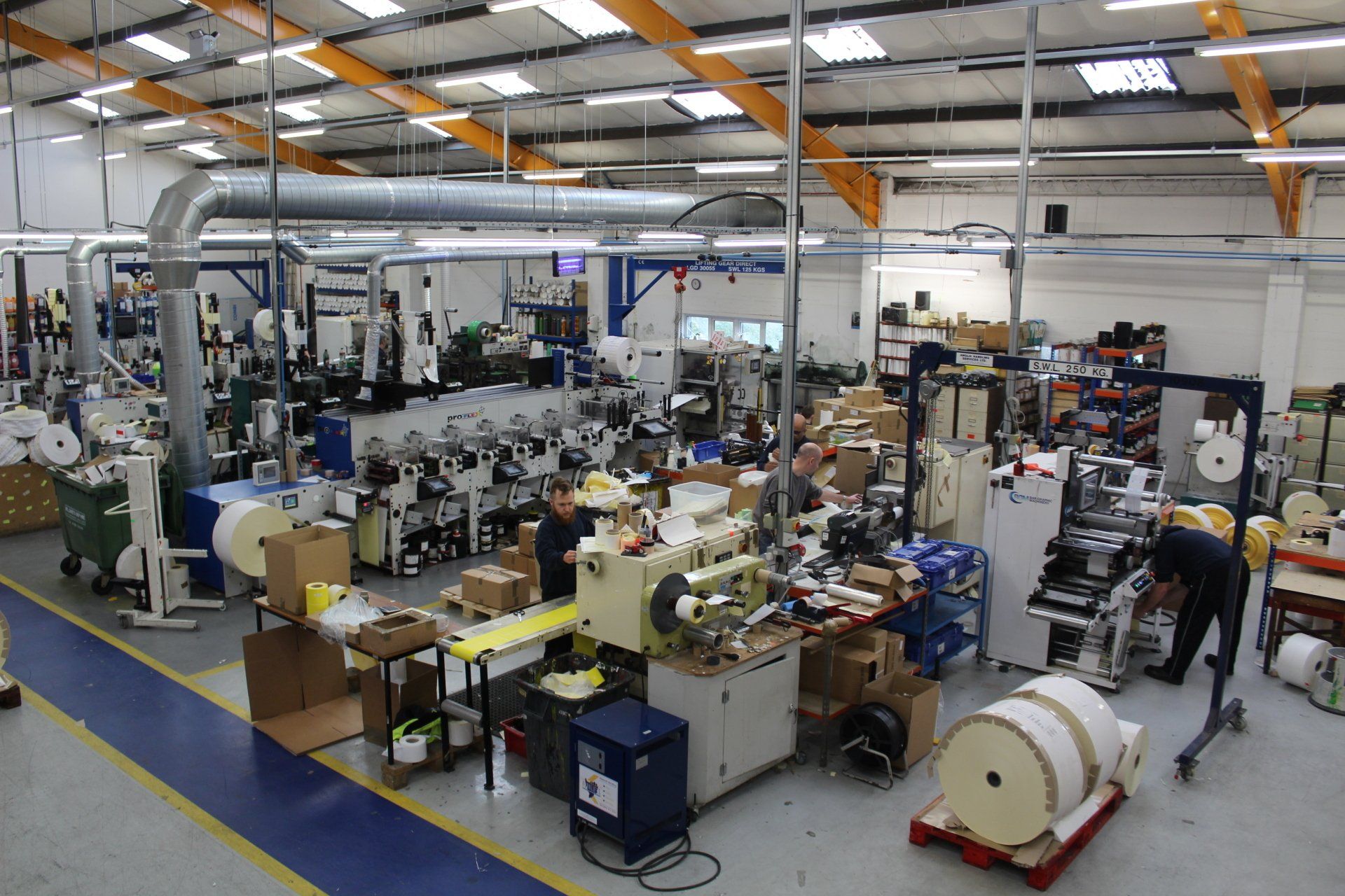 Raised view image of some of the presses in use at the Secura Labels factory