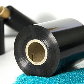 A reel of black thermal transfer ribbon ready to be dispatched