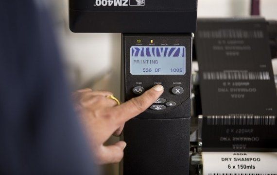 Pressing the button to start printing Thermal Transfer Labels as part of Secura Labels' Bureau Service
