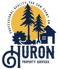 Huron Property Services logo with pine trees, house, and navy-blue lettering on a gold circle