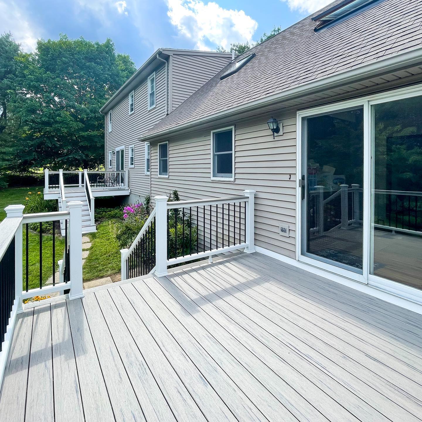 A large house with a large deck in front of it