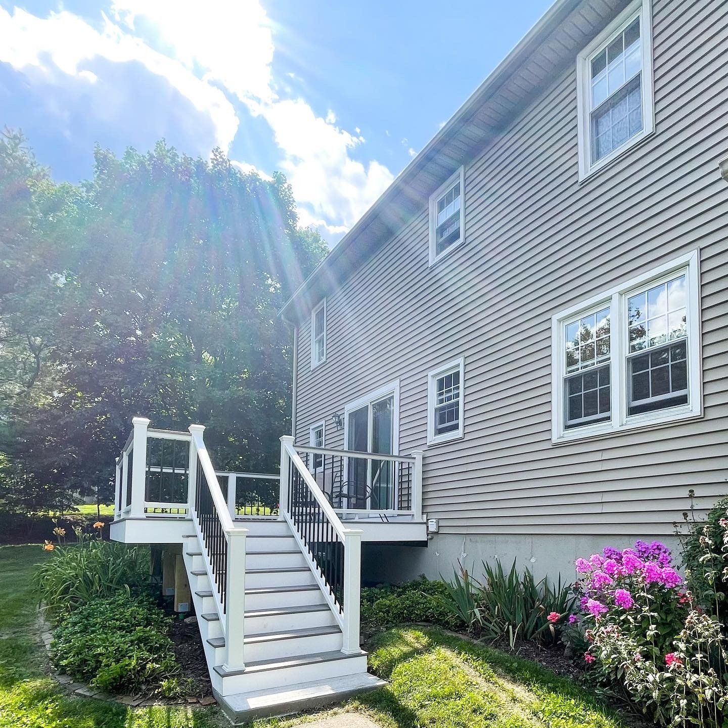 The back of a house with a deck and stairs