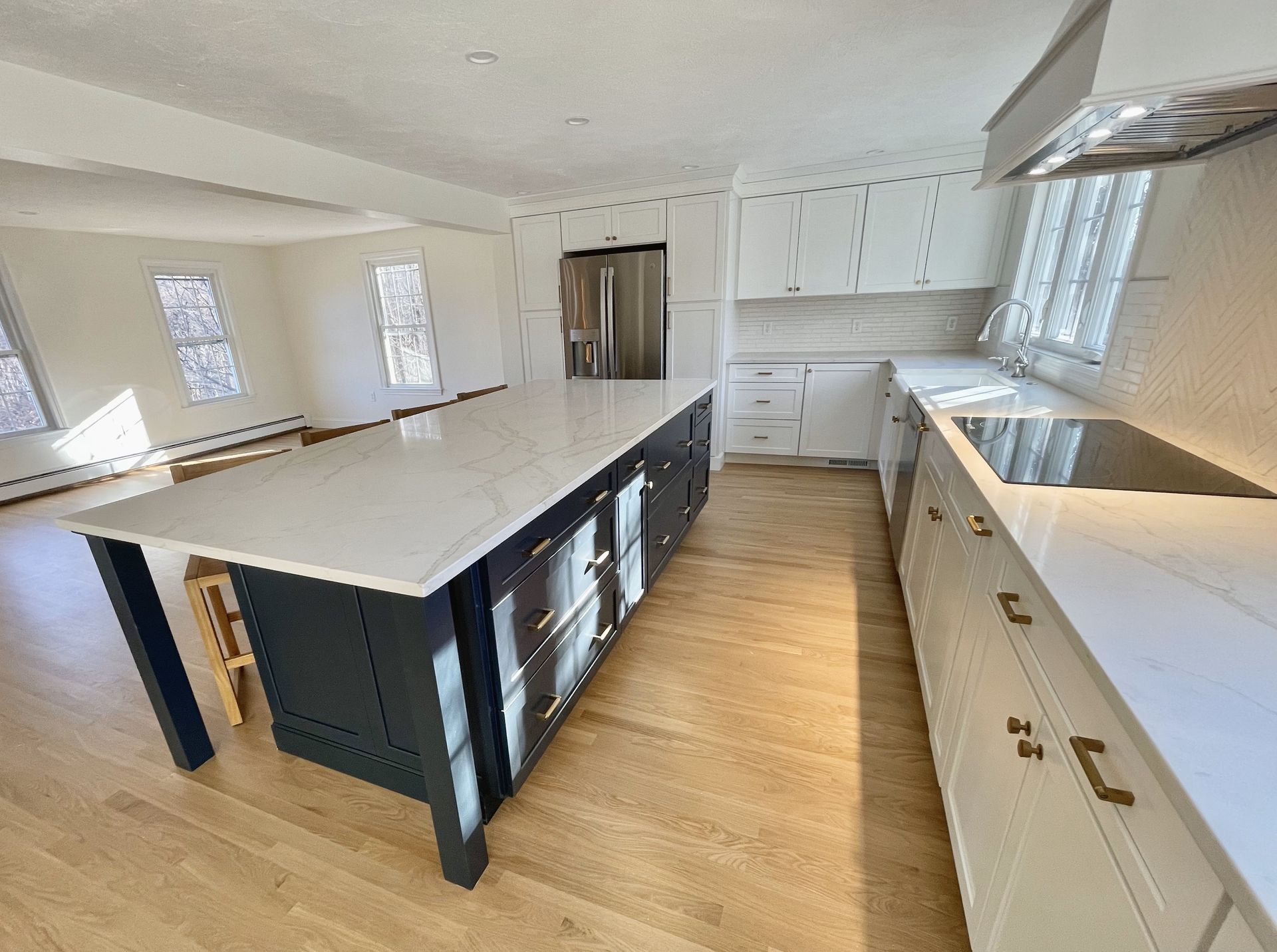 There is a large island in the middle of the kitchen.