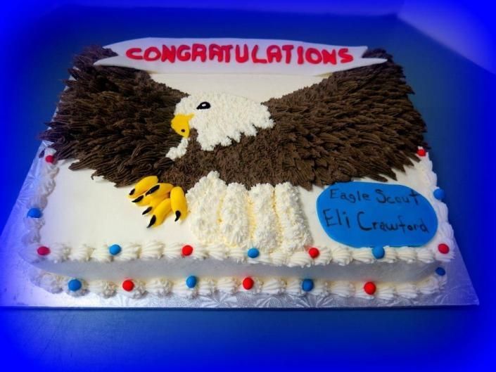 Congratulations cake with eagle and blue plaque reading “Eagle Scout Ethan”