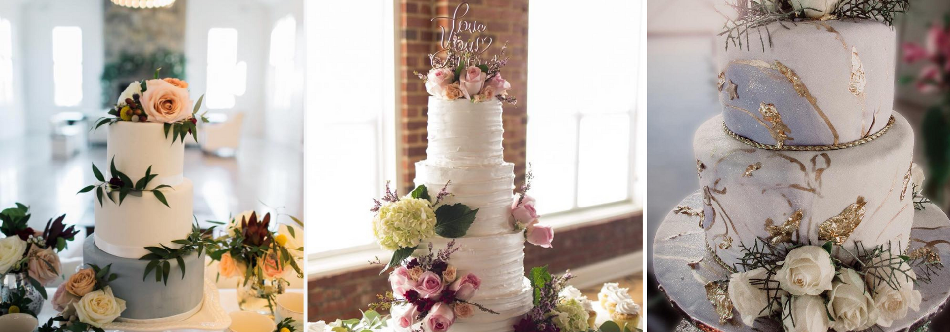 Three elegant white wedding cakes decorated with flowers and gold accents on display.