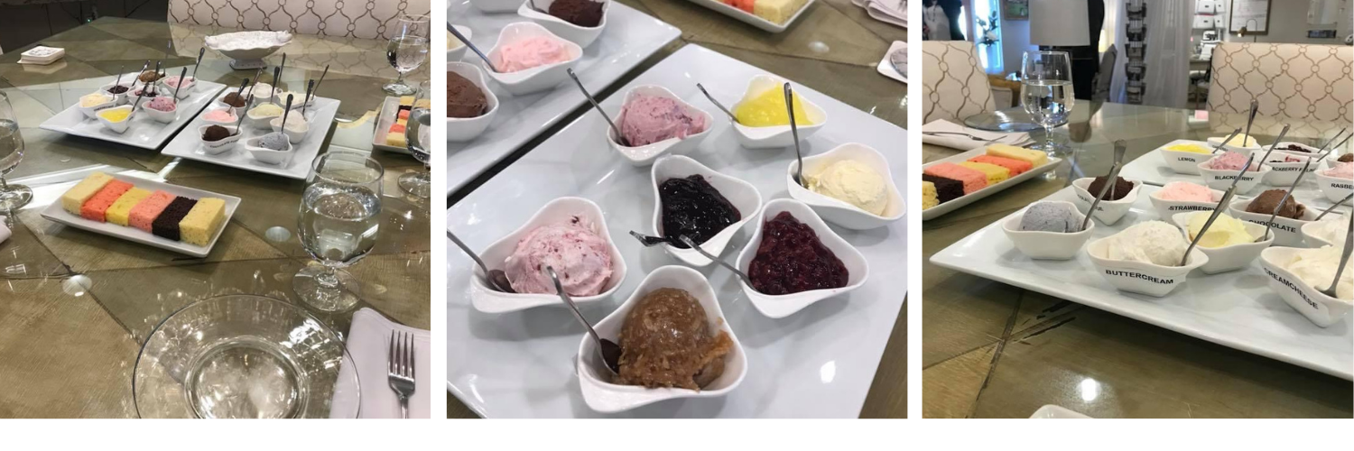 Dessert buffet with square cakes and toppings on a white table in a cafeteria or event setting