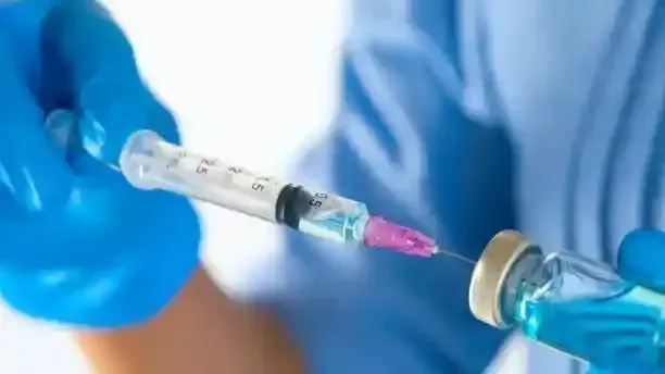 Nurse preparing intramuscular vitamin injection for patient in London, Nurse Agnes service are professional and safe , trusted company CQC Registered