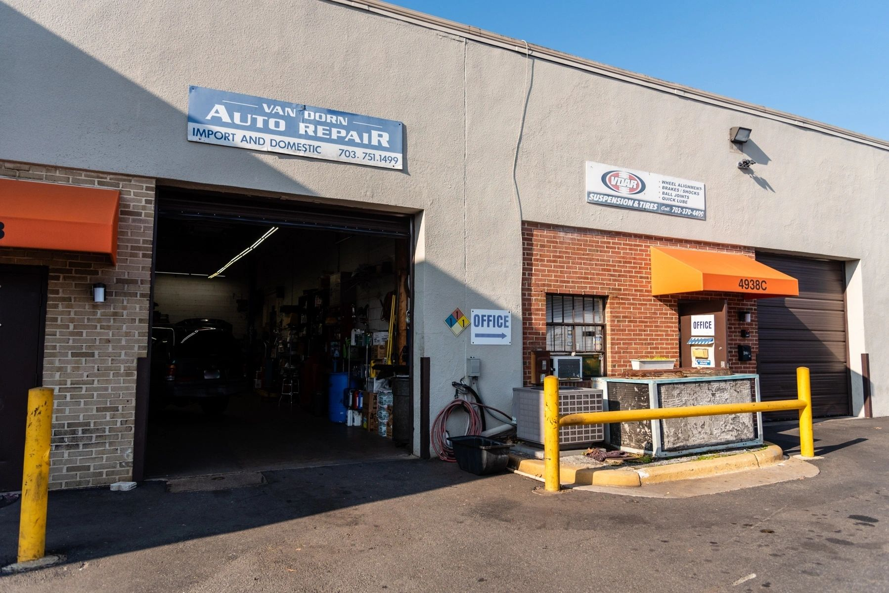A building with a sign that says auto repair on it | Van Dorn Auto Repair