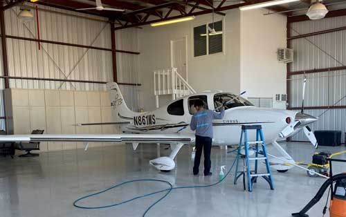 man cleaning aircraft