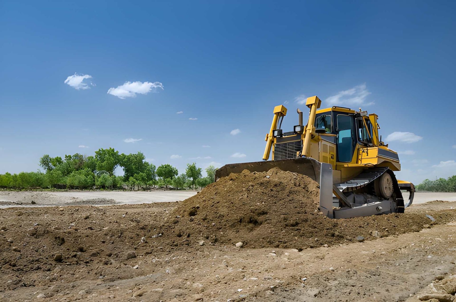 Yellow Bulldozer Pushing Dirt — A & S Cuthel Earthmoving & Transport in Nambucca Heads, NSW