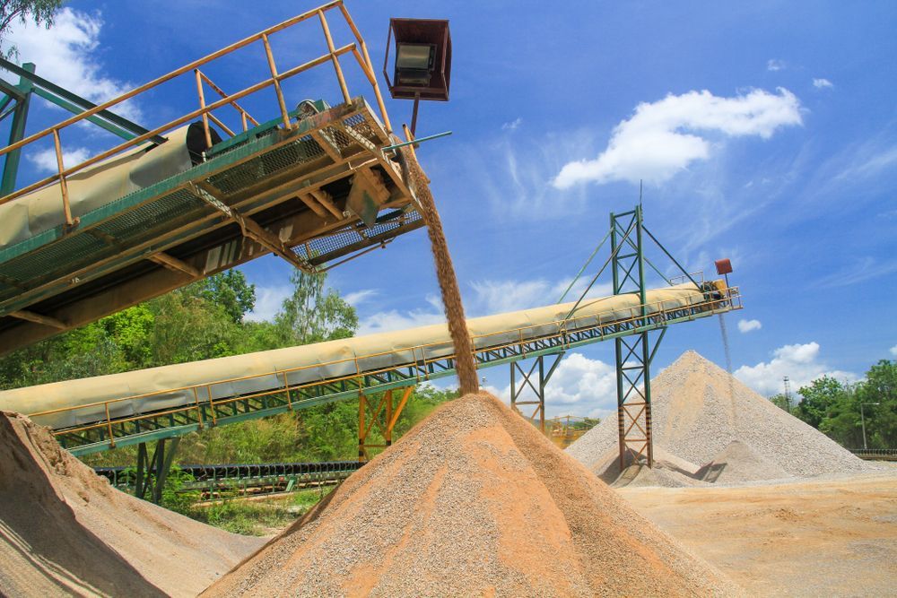 Sand Conveyor Loading Sandy Gravel Into Large Piles — A & S Cuthel Earthmoving & Transport in Dorrigo, NSW