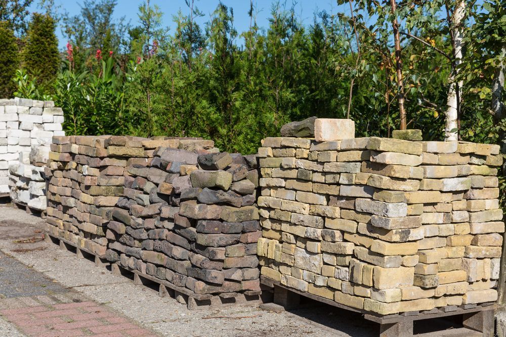 Stacks Of Assorted Stone Pavers — A & S Cuthel Earthmoving & Transport in Bellingen, NSW