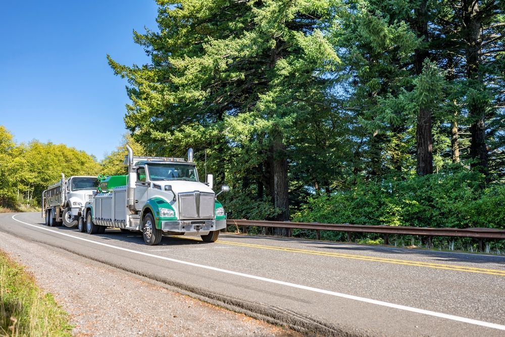 Semi Truck Hauling a Car Trailer — A & S Cuthel Earthmoving & Transport in Armidale, NSW