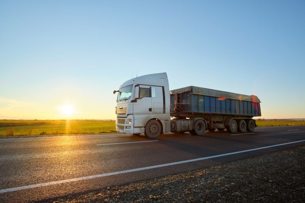 White Semi-Truck Driving on an Open Highway — A & S Cuthel Earthmoving & Transport in Bellingen, NSW