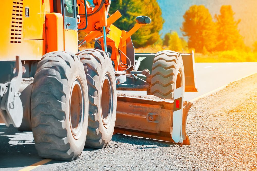 Orange Road Roller Paving Asphalt — A & S Cuthel Earthmoving & Transport in Armidale, NSW