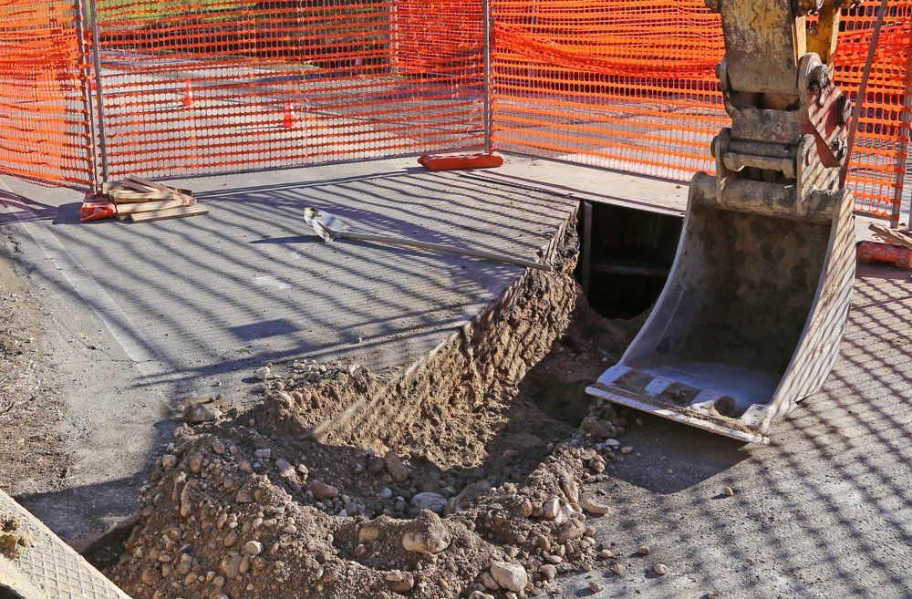 Excavator Pouring Wet Concrete — A & S Cuthel Earthmoving & Transport in Grafton, NSW