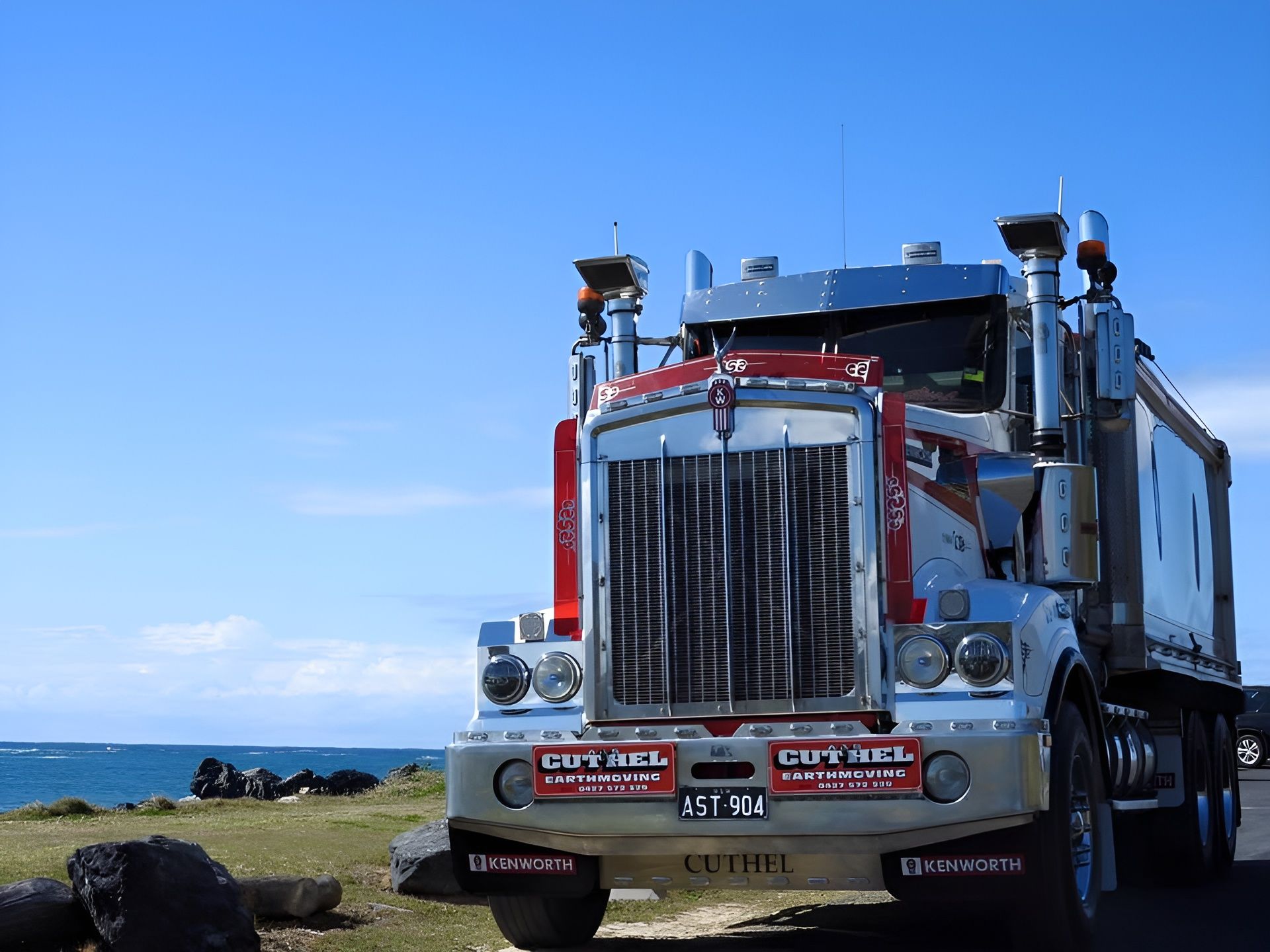 Red and Silver Semi Truck Parked on A Coastal Roadside — A & S Cuthel Earthmoving & Transport in Armidale, NSW