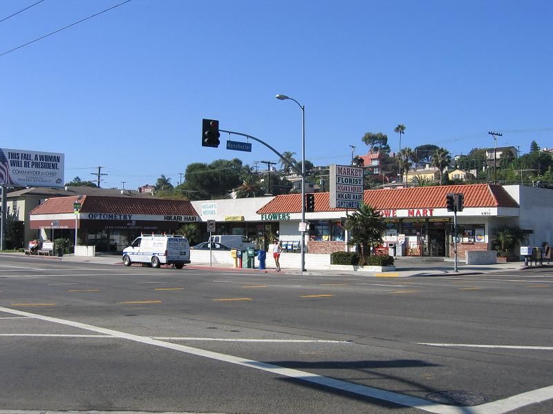 Cars are parked in front of a store called chick-fil-a