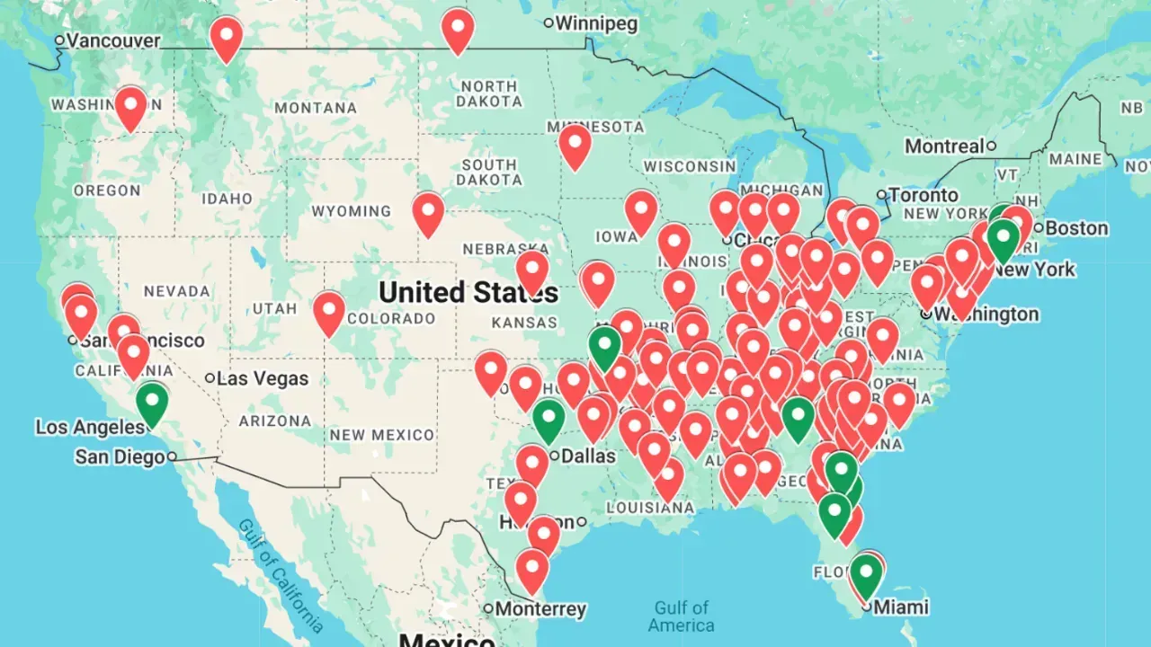 A map of the United States showing a dense cluster of red pins and a few green pins concentrated in the eastern half.