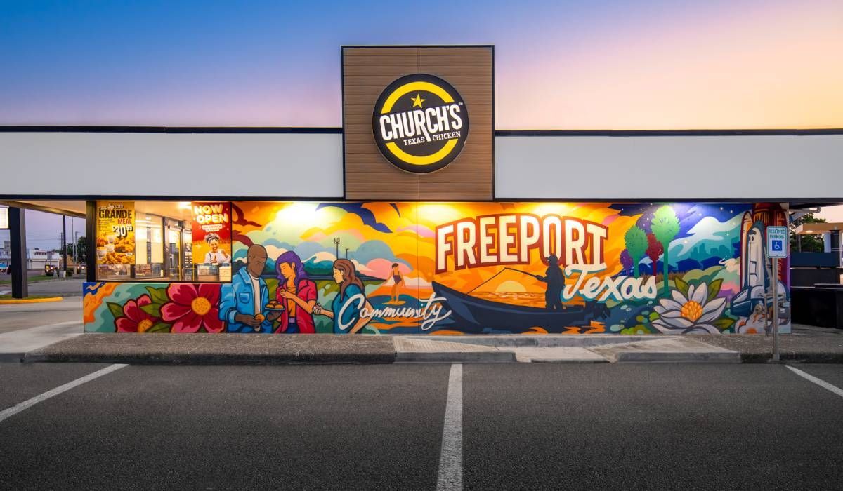 A Church's Texas Chicken restaurant exterior featuring a vibrant, colorful mural of Freeport, Texas.