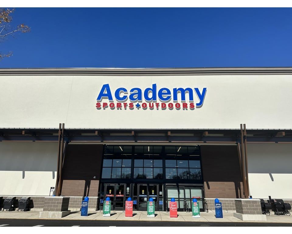 A flat, single-story retail building with a