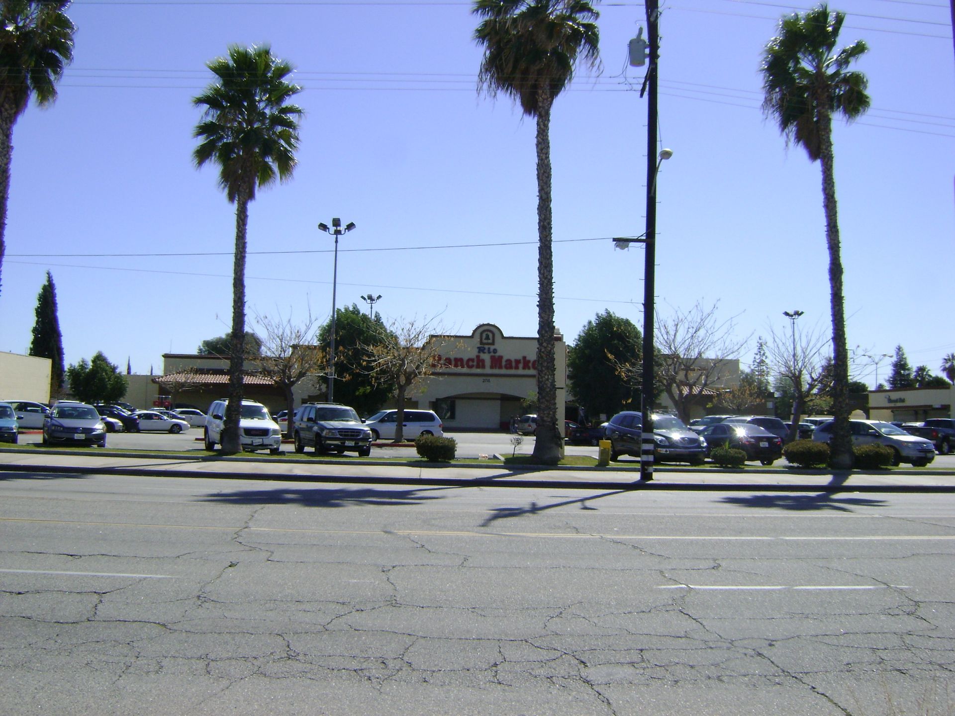 Cars are parked in front of a store called chick-fil-a