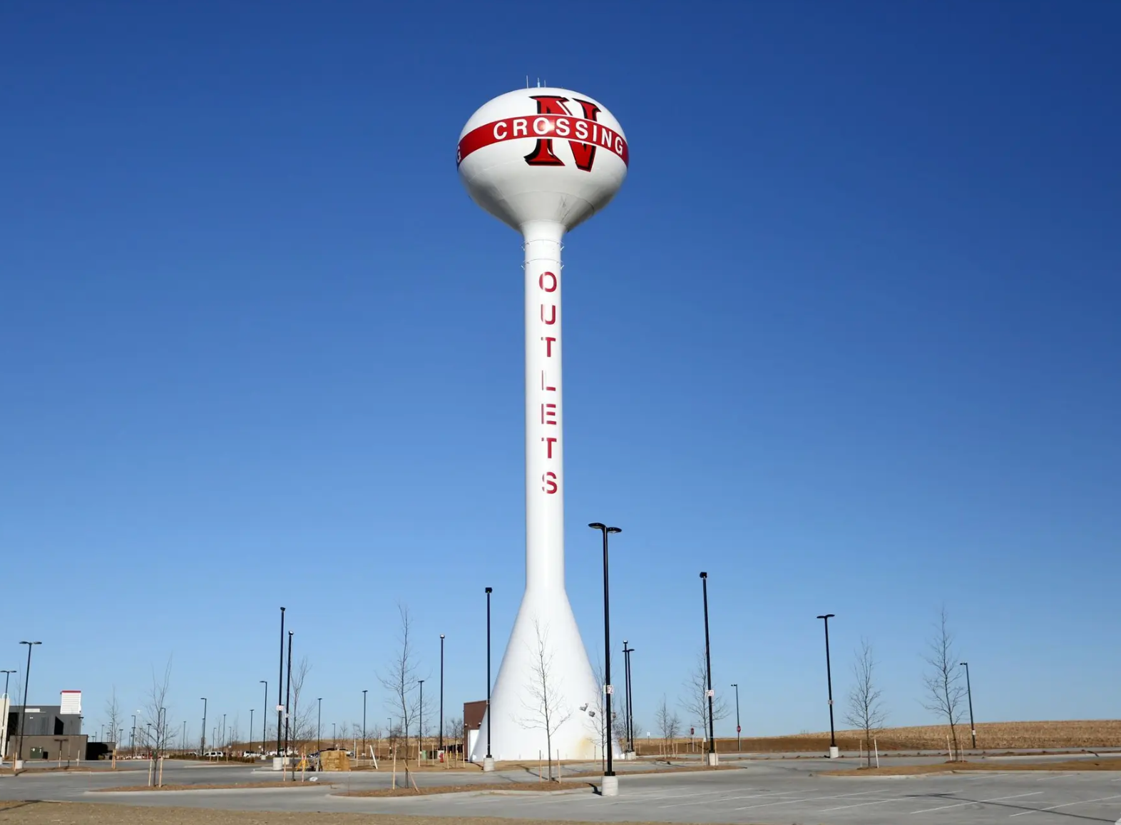 A tall white water tower with