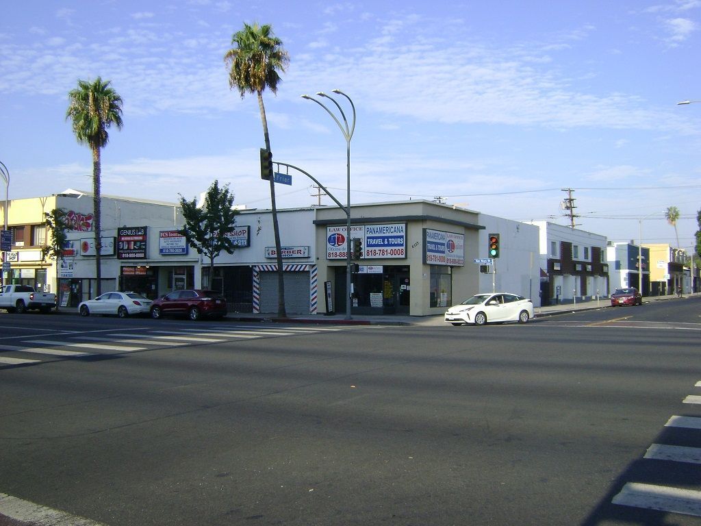 Cars are parked in front of a store called chick-fil-a