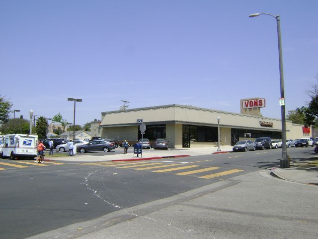 Cars are parked in front of a store called chick-fil-a
