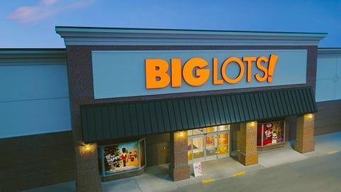 The entrance to a Big Lots retail store, featuring the bright orange company logo on a light blue sign above a dark awning.