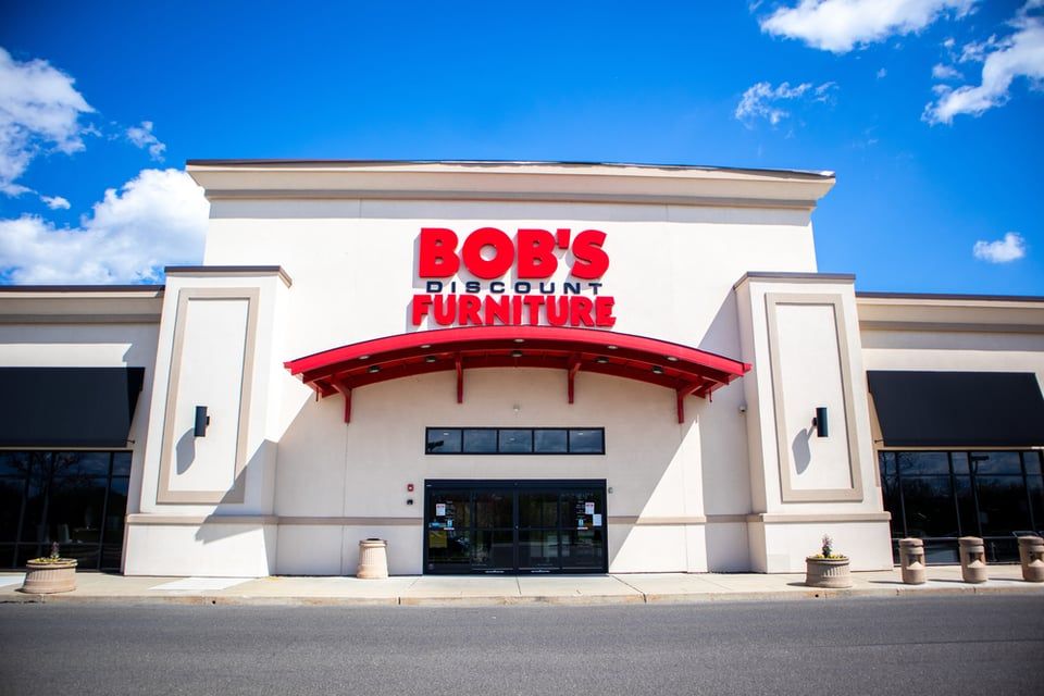 A flat, single-story retail building with a