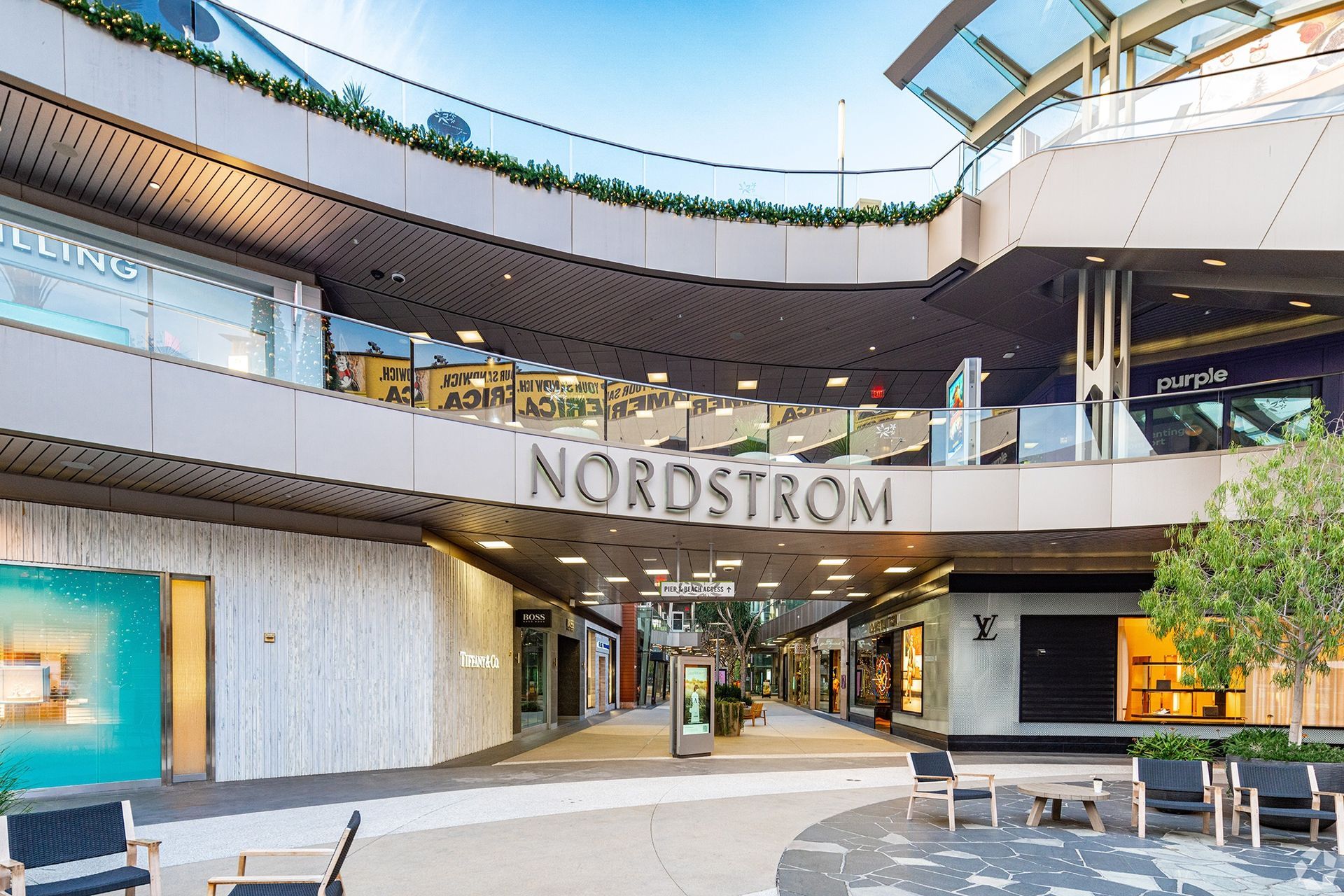 An outdoor shopping center with a large 