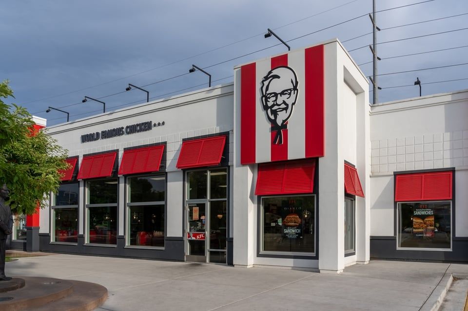 A flat, single-story retail building with a