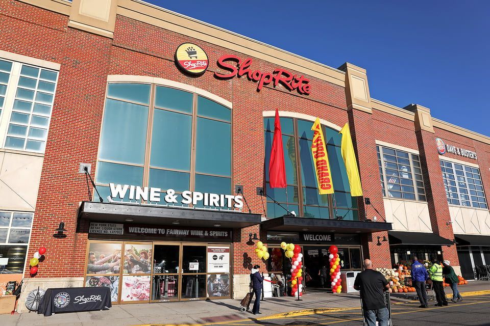 Exterior of a red brick ShopRite store with a 