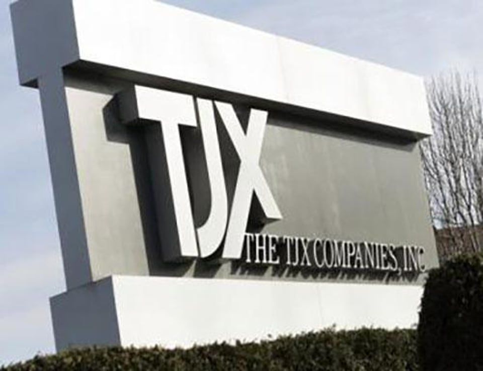 A large, gray outdoor sign displaying the logo and text