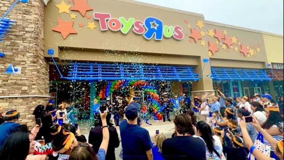 Crowd gathers outside a Toys