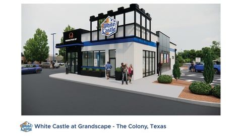 A rendering of a White Castle restaurant exterior with white walls and blue trim at Grandscape in The Colony, Texas.