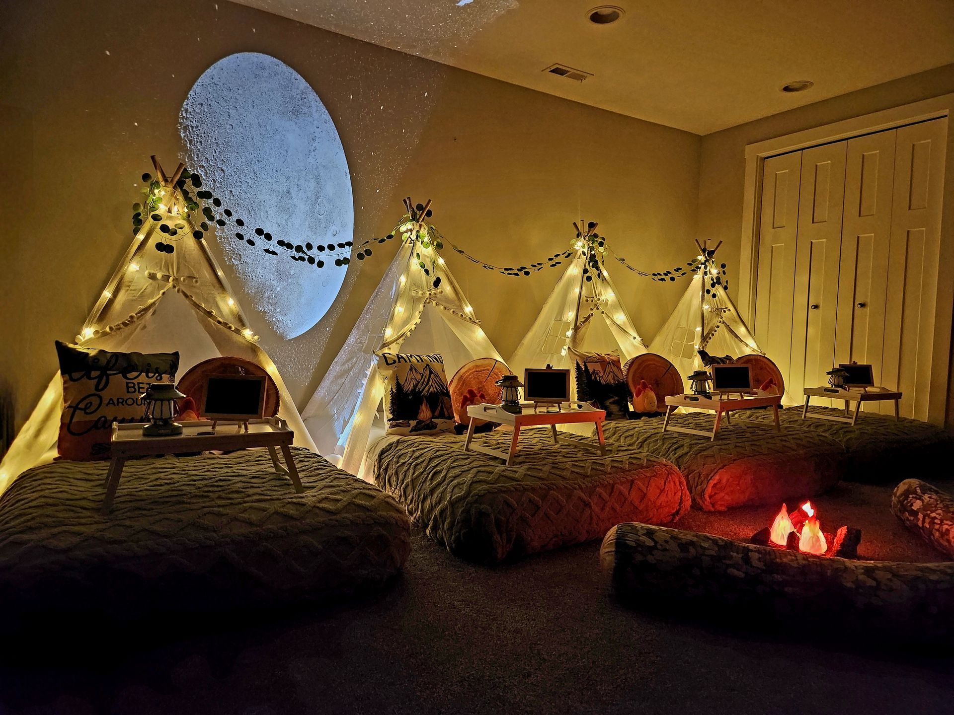 Kids birthday sleepover party with individual tents and themed decor in Will County IL