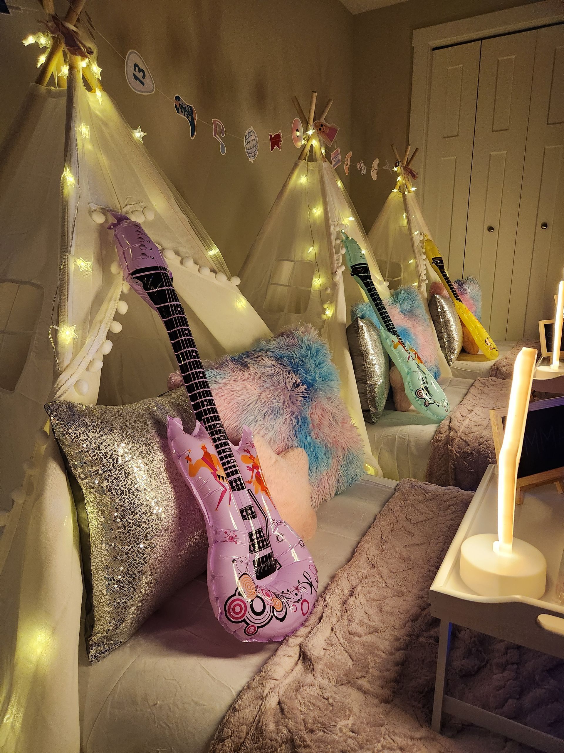 Themed throw pillows and decor inside sleepover party tent near Peotone Illinois